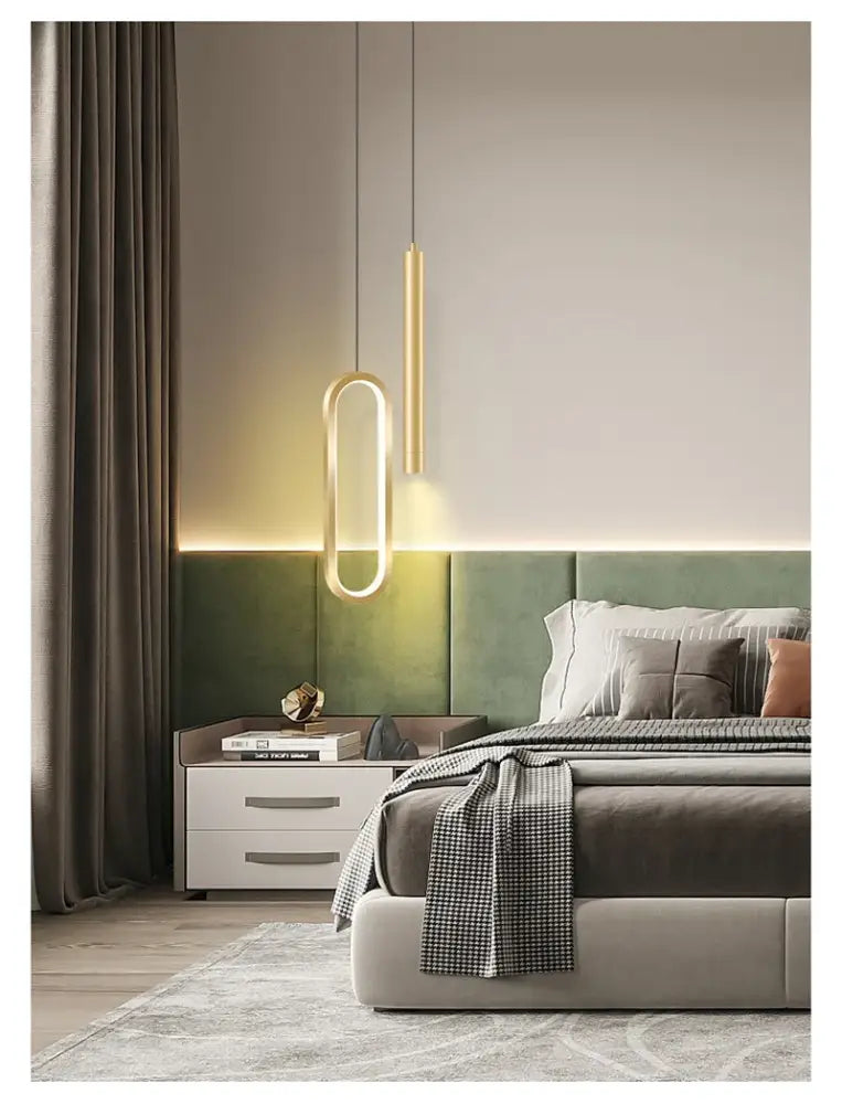 DecorBites™ Nordic led pendant light in gold tone with sleek elongated oval design hanging above the bed