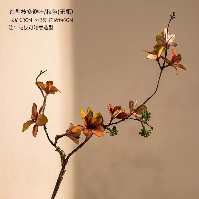 Decorbites nordic luxe artificial autumn branch in a frosted glass vase with warm orange and rust leaves