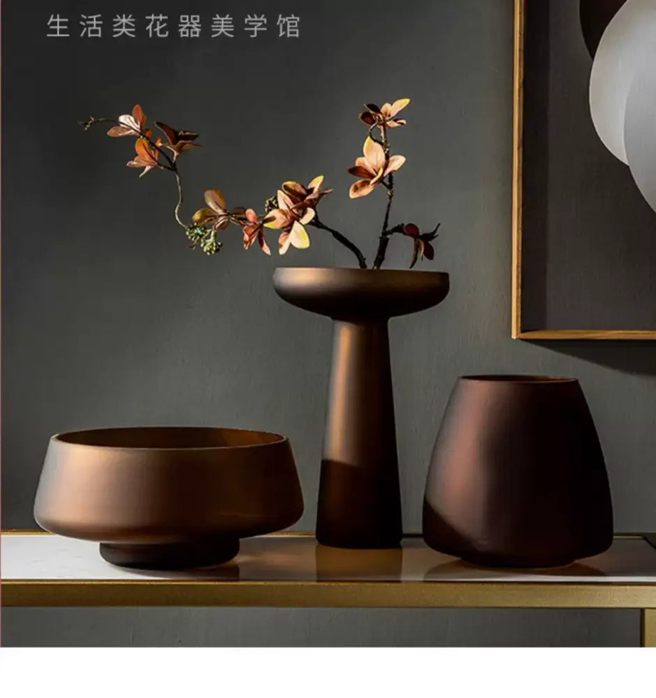 Decorbites™ nordic luxe frosted glass vase with bronze-toned ceramic base holding dried orchid branches
