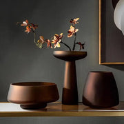 DecorBites™ Nordic Luxe matte bronze ceramic vase with autumn branches complements frosted glass vase decor