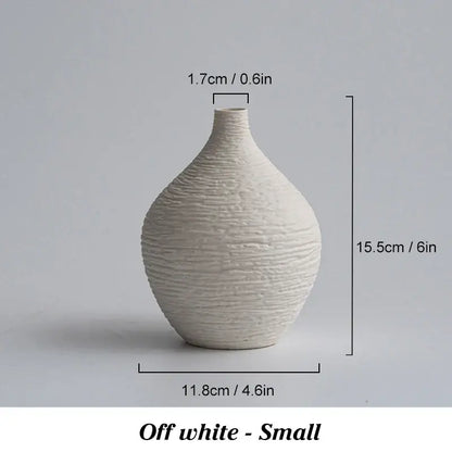 Off-white ceramic vase with textured ribbed surface and rounded shape for nordic luxury ceramic home décor by decorbites