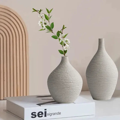 Two off-white textured nordic luxury ceramic vases with ribbed surfaces for elegant home décor by decorbites