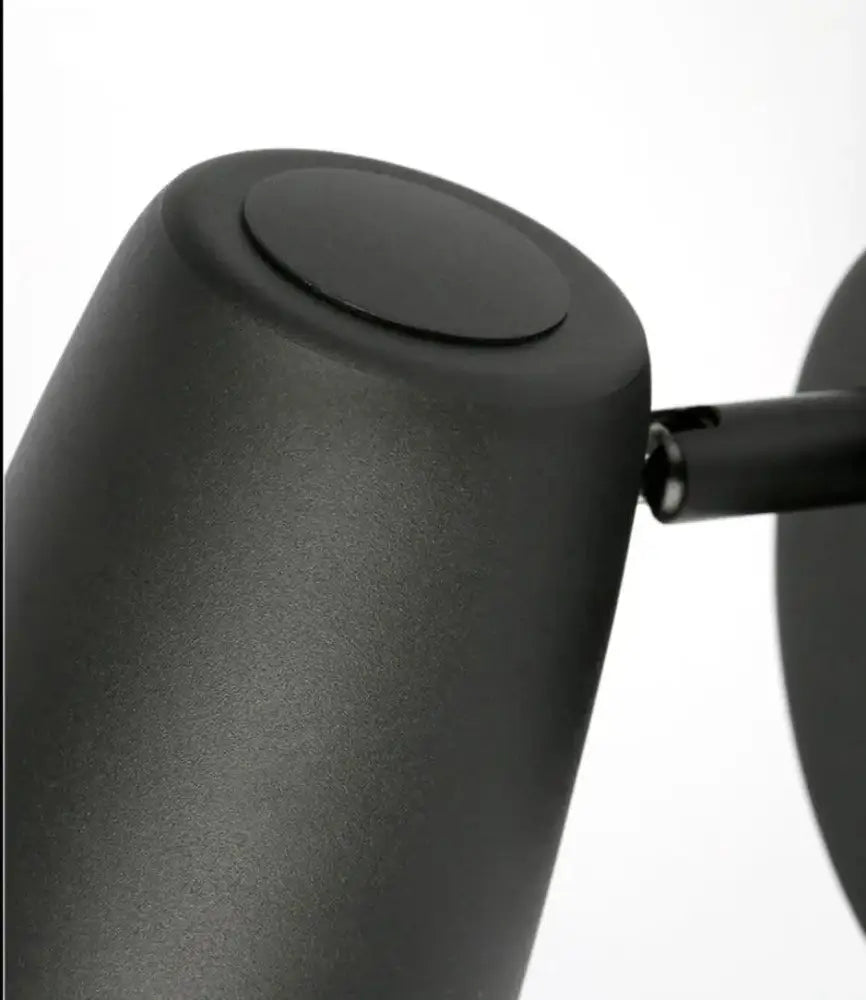 DecorBites™ nordic modern wall sconces featuring a black matte cylindrical lamp head with a smooth rounded top
