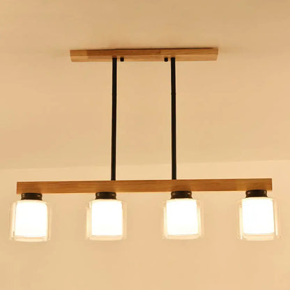 DecorBites™ nordic modern wood island pendant with four frosted glass shades and black metal accents