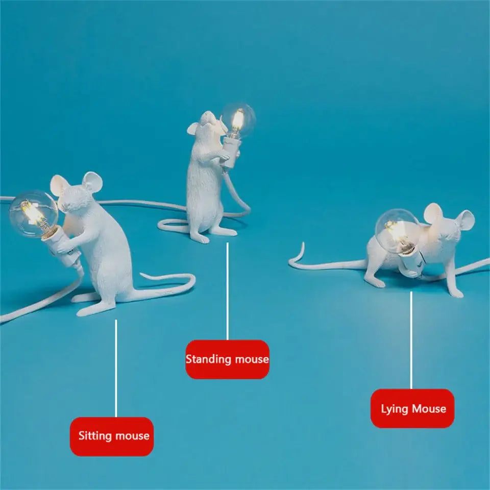 White ceramic DecorBites™ nordic mouse led table lamps holding lit bulbs in various poses as unique led table lamps