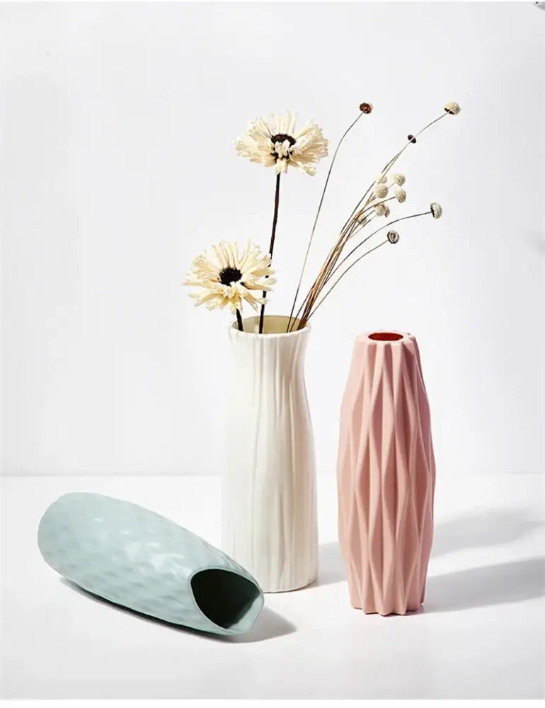 Decorbites™ nordic plastic vase with tall slender silhouette and vertical ribbed texture in soft blush pink ceramic finish