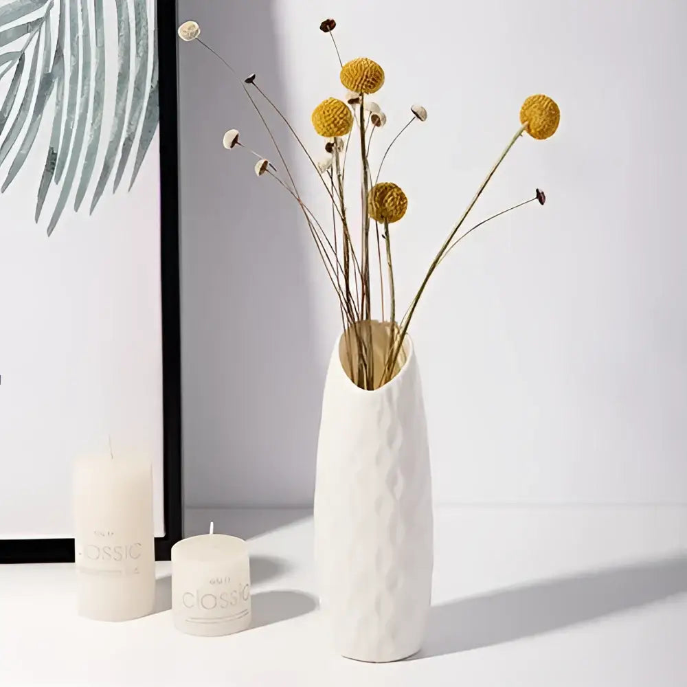 White ceramic nordic plastic vase with textured diamond pattern and elongated neck for modern home decor by DecorBites