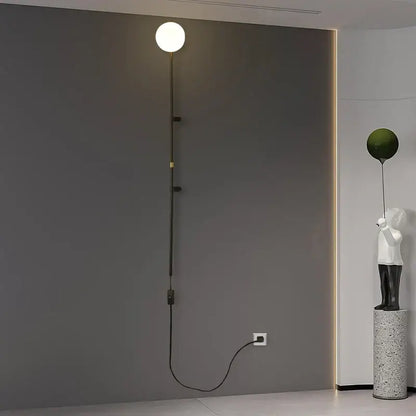 Modern minimalist DecorBites™ nordic plug in wall lamp sconce with spherical white glass bulb and black metal arm