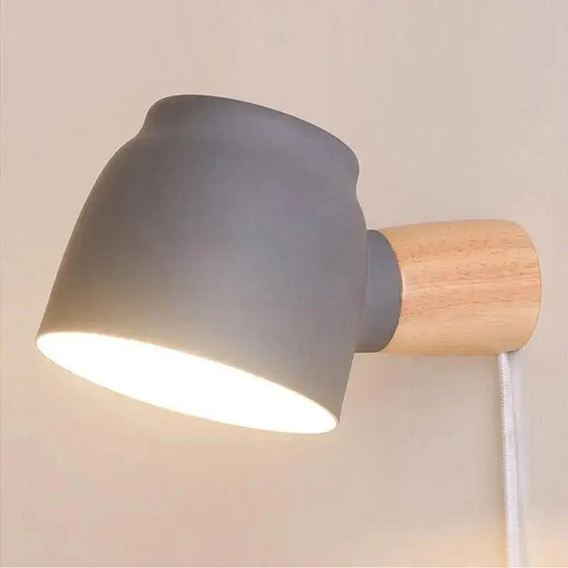 Gray ceramic wall sconce with natural wood base and exposed white cord for plug-in wall light by DecorBites™ Nordic