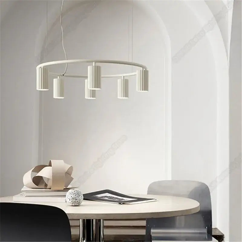 Modern white circular pendant light with cylindrical fixtures by decorbites™ nordic donna circle chandelier for dining and kitchen