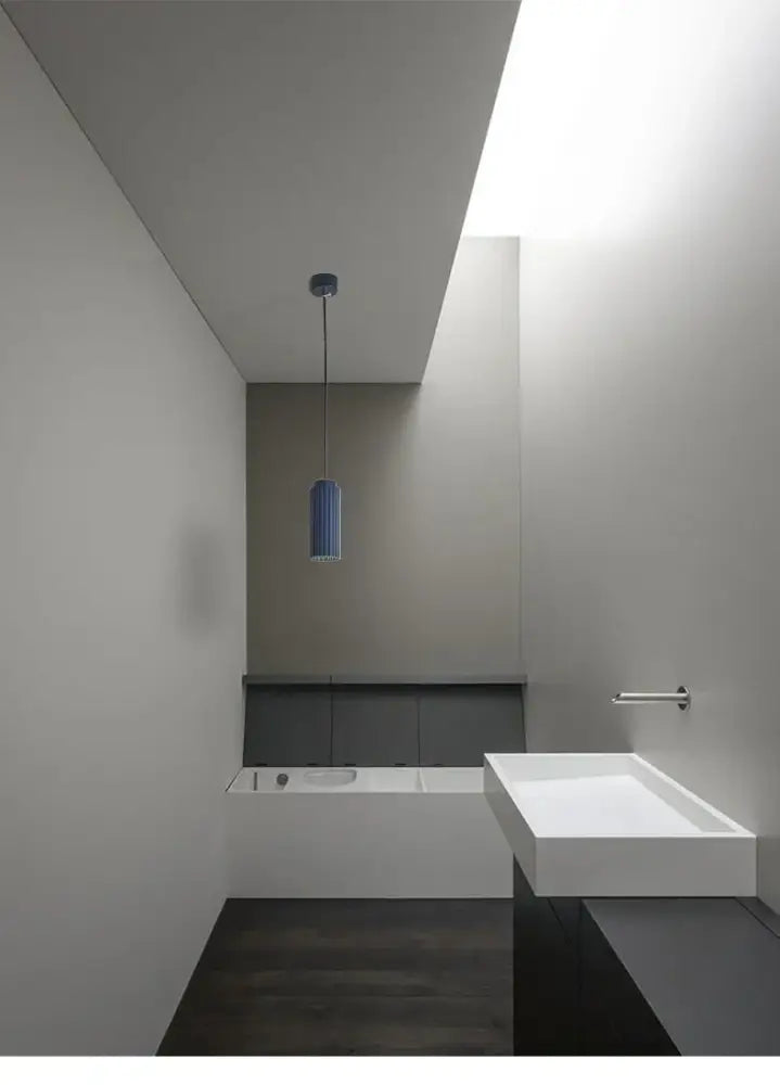 A sleek blue glass pendant light from the decorbites nordic rotatable donna circle chandelier for dining and kitchen