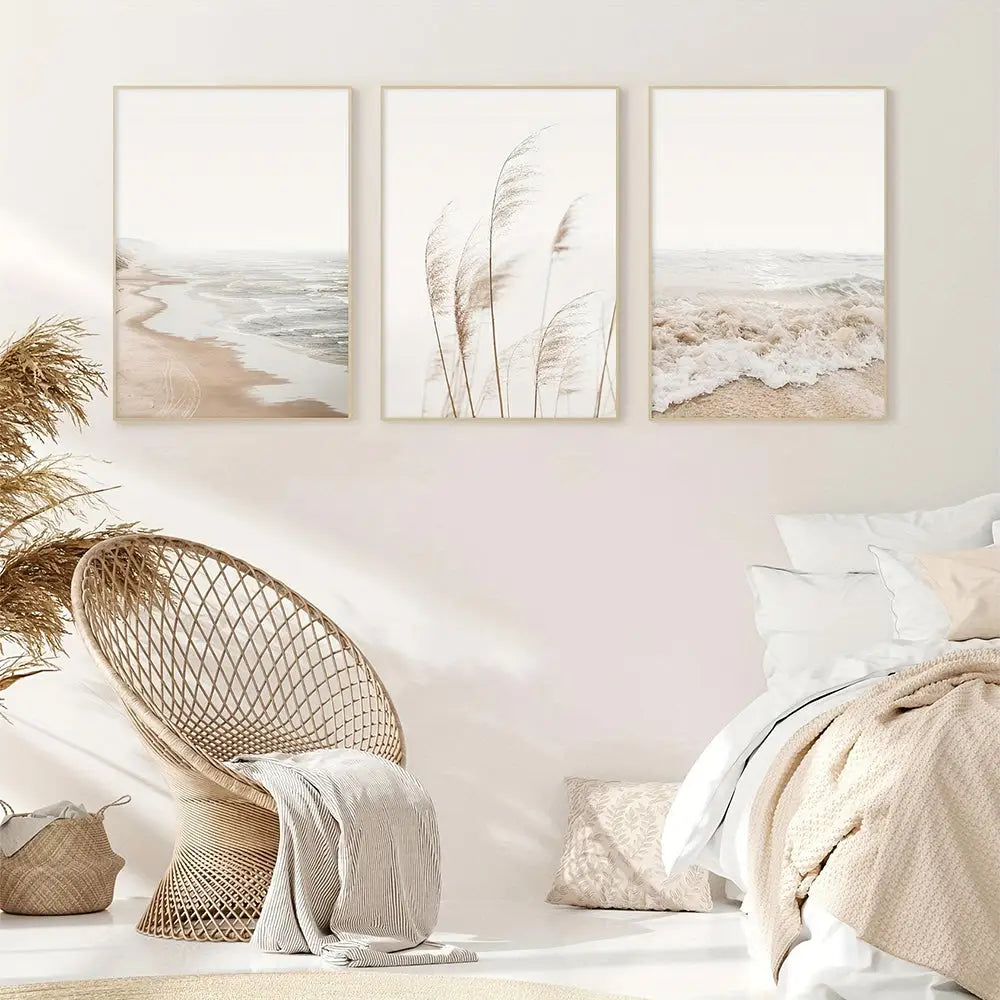 Beige woven wicker egg chair with textured fabric draped over back paired with nordic seascape canvas wall art