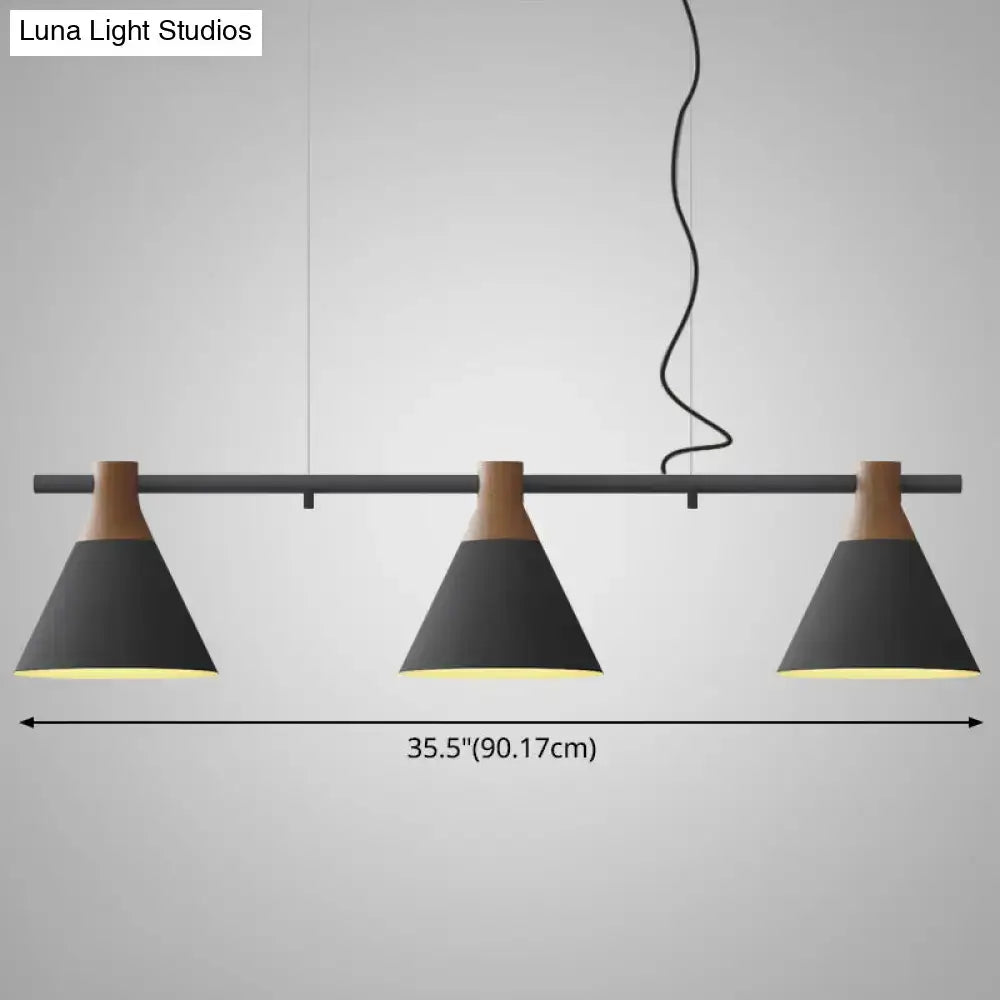 Modern black and wood-toned nordic style pendant light with three conical metal shades and adjustable chain cord length