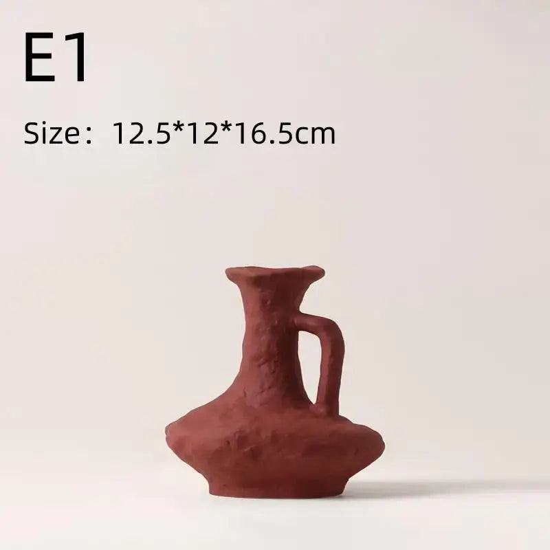 Terracotta-colored nordic style ceramic pitcher with textured handcrafted surface and integrated handle for flower pot use