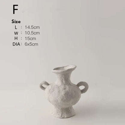 A textured white nordic style ceramic flower pot with two handles and a flared opening by decorbites