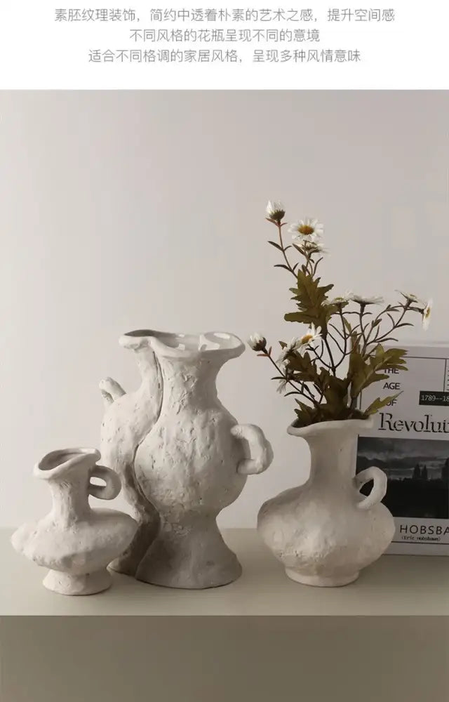 White ceramic nordic style flower pot with textured organic surface and handle by decorbites