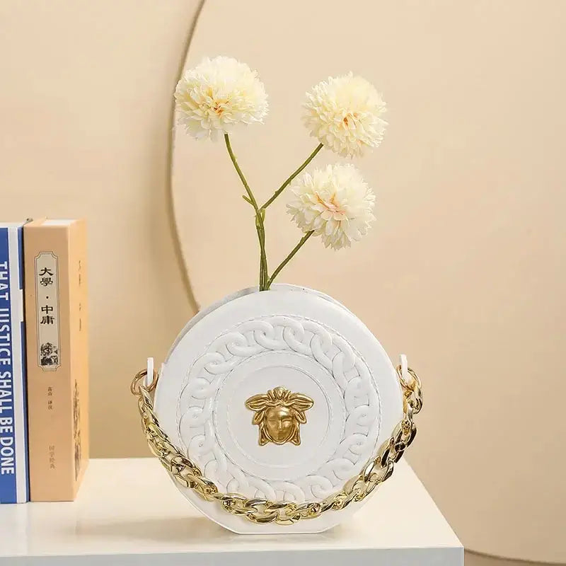 White nordic style ceramic flower vase with embossed patterns gold chain strap and medusa head clasp half face design