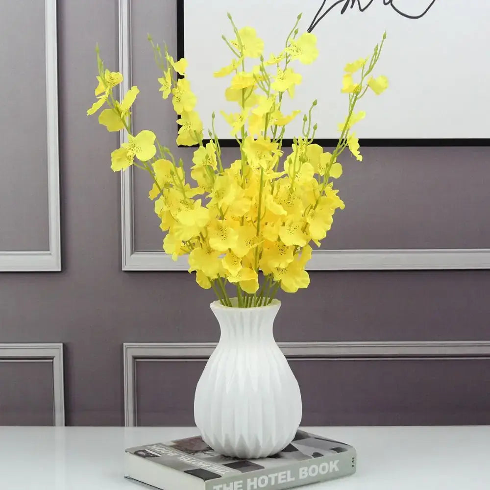 DecorBites™ nordic style white ceramic flower vase with ribbed texture holding bright yellow artificial flowers