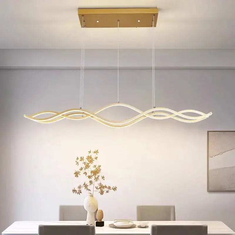 Modern gold-finished DecorBites Nordic style dining room chandelier with sleek wave-like design and illuminated led lighting
