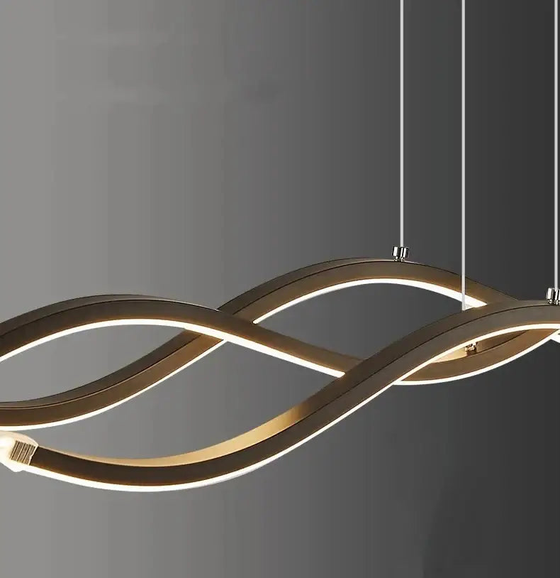 Modern gold-toned led pendant light with sleek wave design and glowing illumination for nordic style dining room