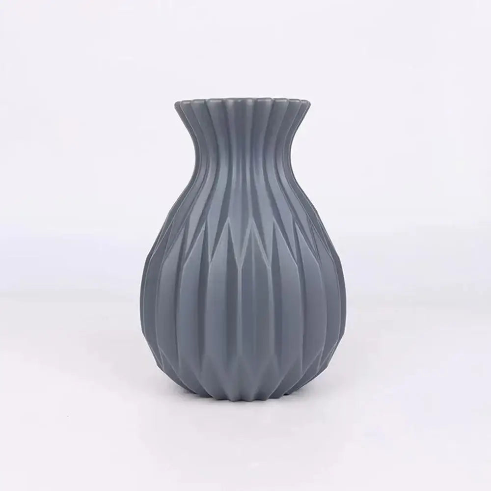 A sleek matte gray decorbites™ nordic style ceramic flower vase with fluted geometric design for home decor