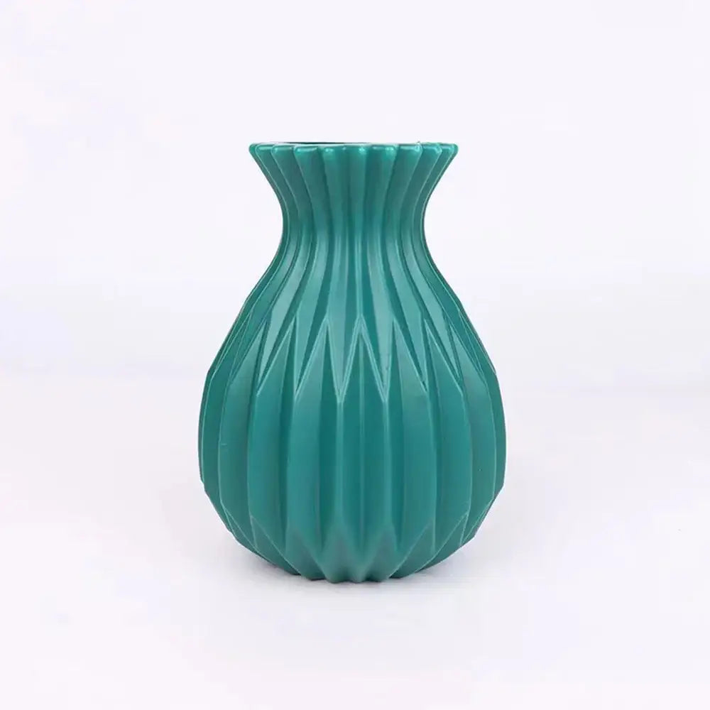 Teal-colored plastic flower vase with fluted geometric pattern from DecorBites™ nordic style home decor collection