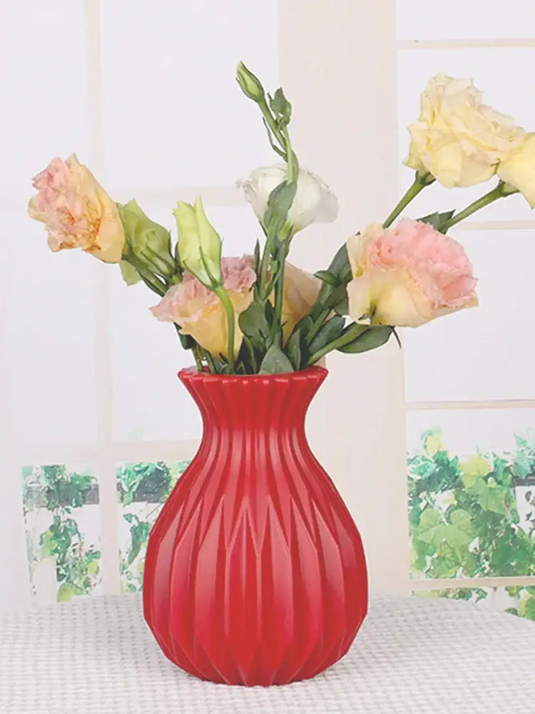Vibrant red plastic flower vase by decorbites with fluted geometric pattern for nordic home decor use