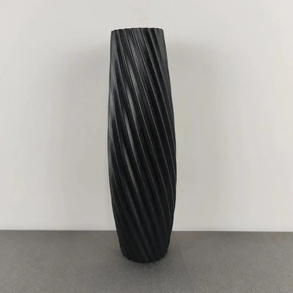 Black ceramic flower vase with a sleek twisted ribbed design from DecorBites™ nordic style plastic flower vase collection