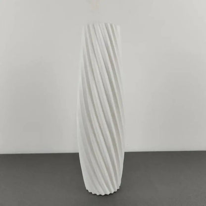 A tall white ceramic flower vase with a twisted ribbed design for plastic flower decor by DecorBites™ Nordic style