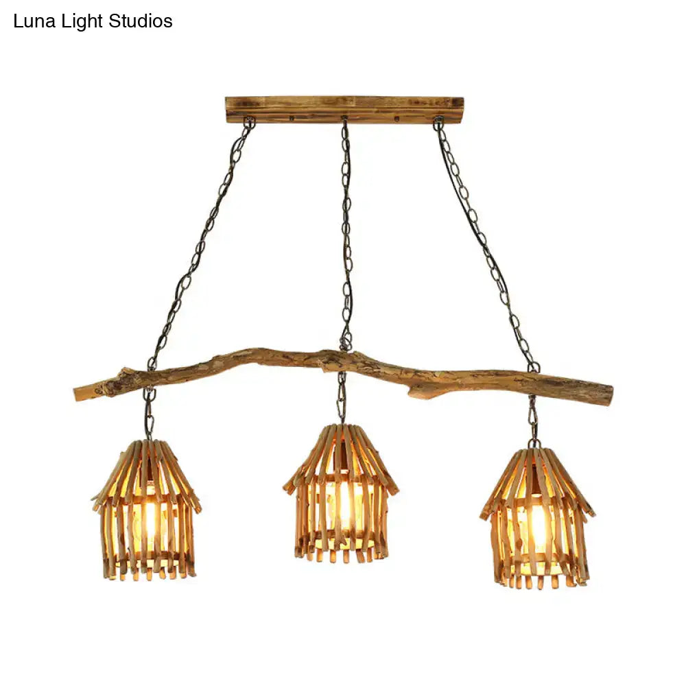 Rustic wooden house shaped pendant light with three woven bamboo shades and black metal chains ideal for dining room