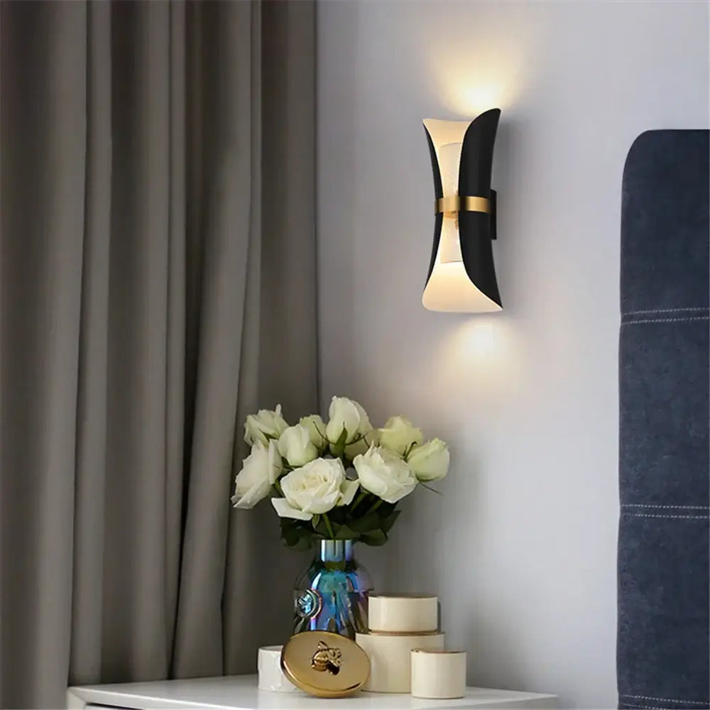 Modern black and gold wall lamp by decorbites with curved sculptural design perfect as a nordic wall lamp