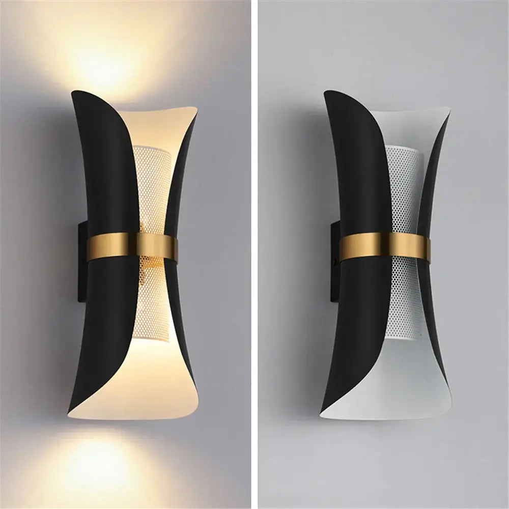 DecorBites™ nordic wall lamp in black and gold with a curved sculptural design and perforated central panel