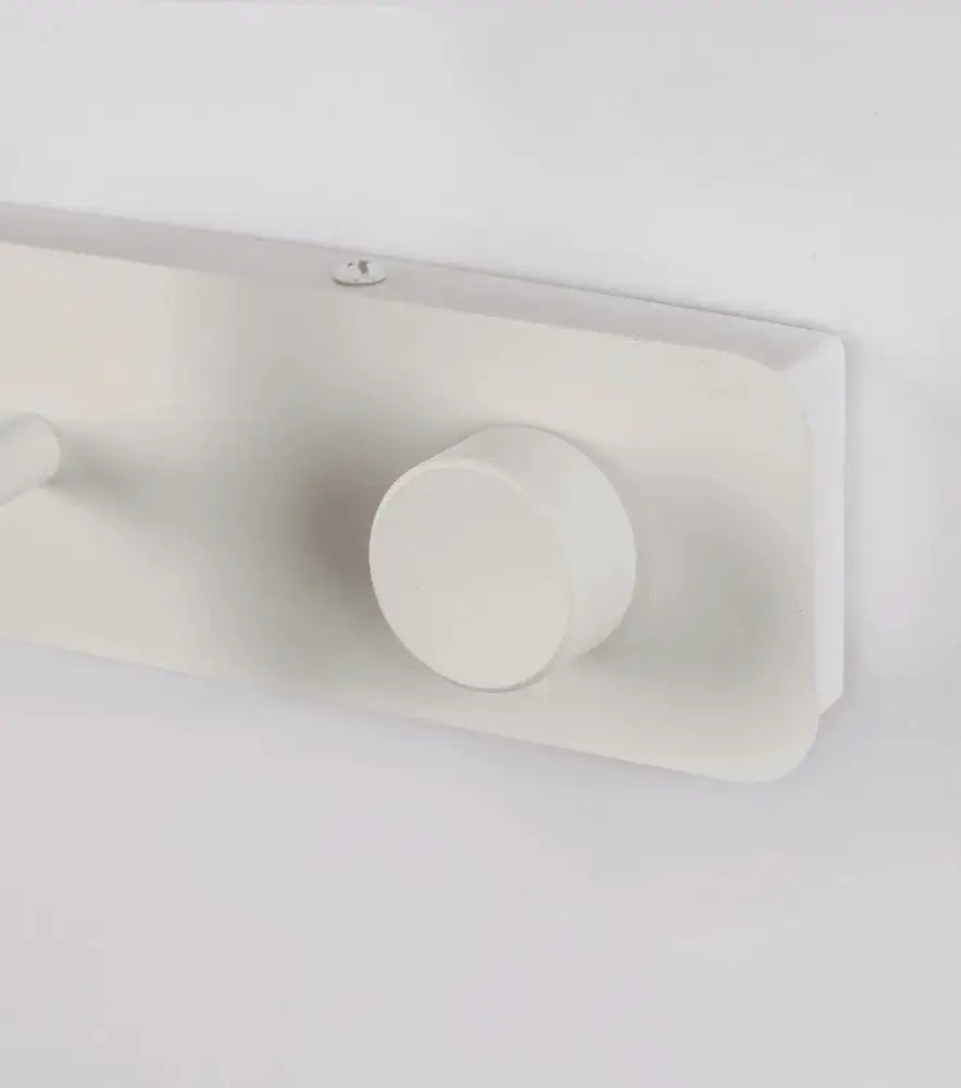 Off-white rectangular wall-mounted coat rack with smooth matte finish and two hooks for nordic wall lights decor
