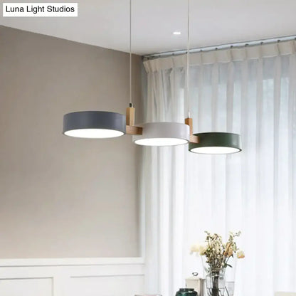 Modern three-light dining room pendant with matte gray, white, and dark green acrylic shades, bulb included, white warm light