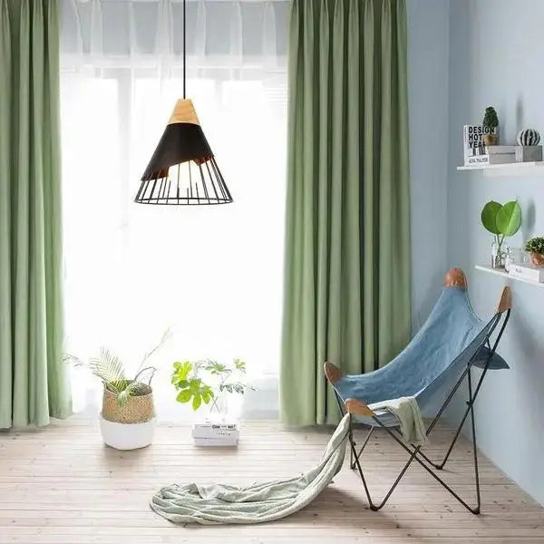 Green velvet curtains with subtle sheen and soft pleats complement decorbites™ nordic wood hanging lights