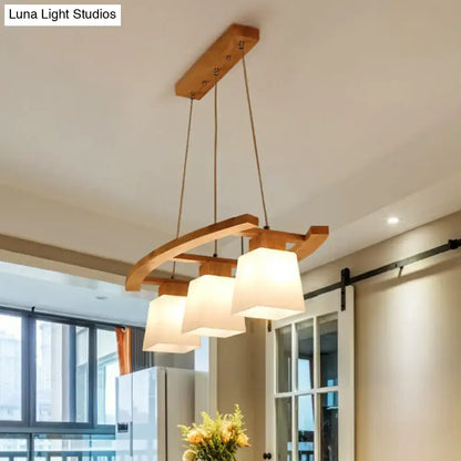 DecorBites™ nordic wood island pendant ceiling light with three off-white fabric shades and natural wood frame for dining room