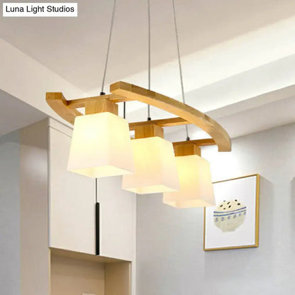 Modern wooden pendant ceiling light with three warm white glass shade squares for dining room by decorbites