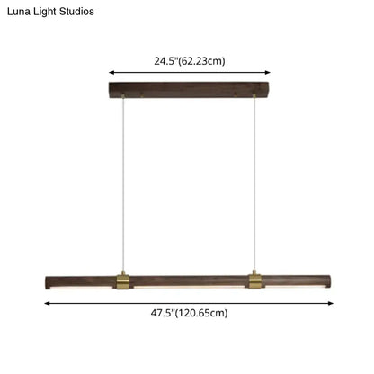 Modern rectangular wood island pendant light in brown with dark wood finish and brass accents for dining table use