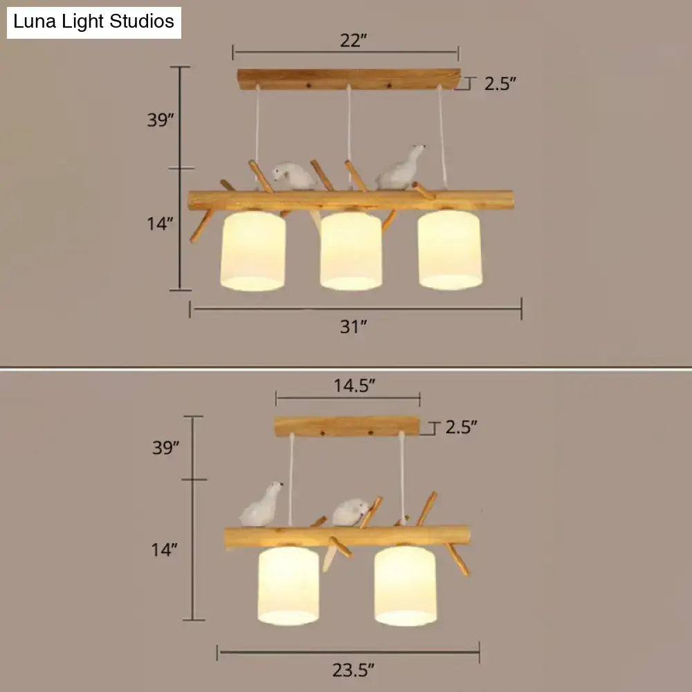 DecorBites™ Nordic wood pendant light with opal glass cylinder shades and resin bird decor on natural wood branches