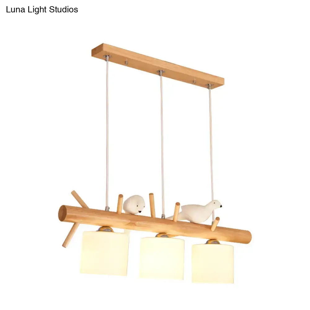 DecorBites™ Nordic wood pendant light with opal glass cylinder shades and resin bird decor on natural wood beam