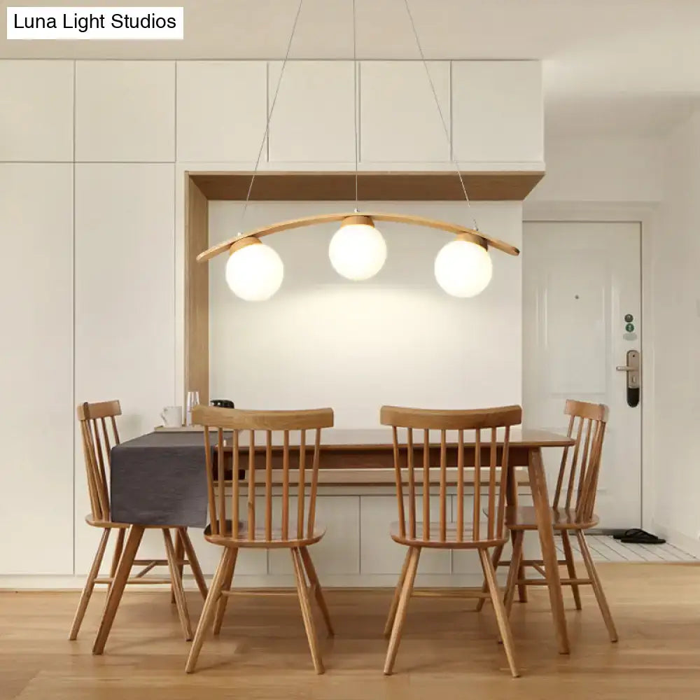 DecorBites Nordic wooden ceiling light with three white glass shades and frosted glass globes for dining rooms