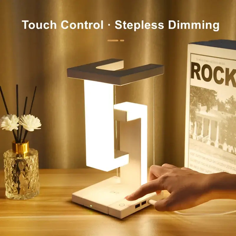 Modern white and black geometric desk lamp with touch control and detachable wireless charger for bedroom and office use