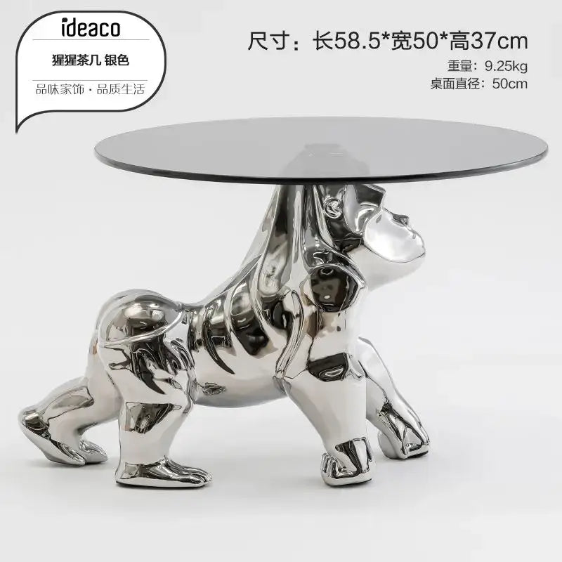 Silver gorilla-shaped coffee table with round glass top featured as decorbites octopus glass gold resin side table