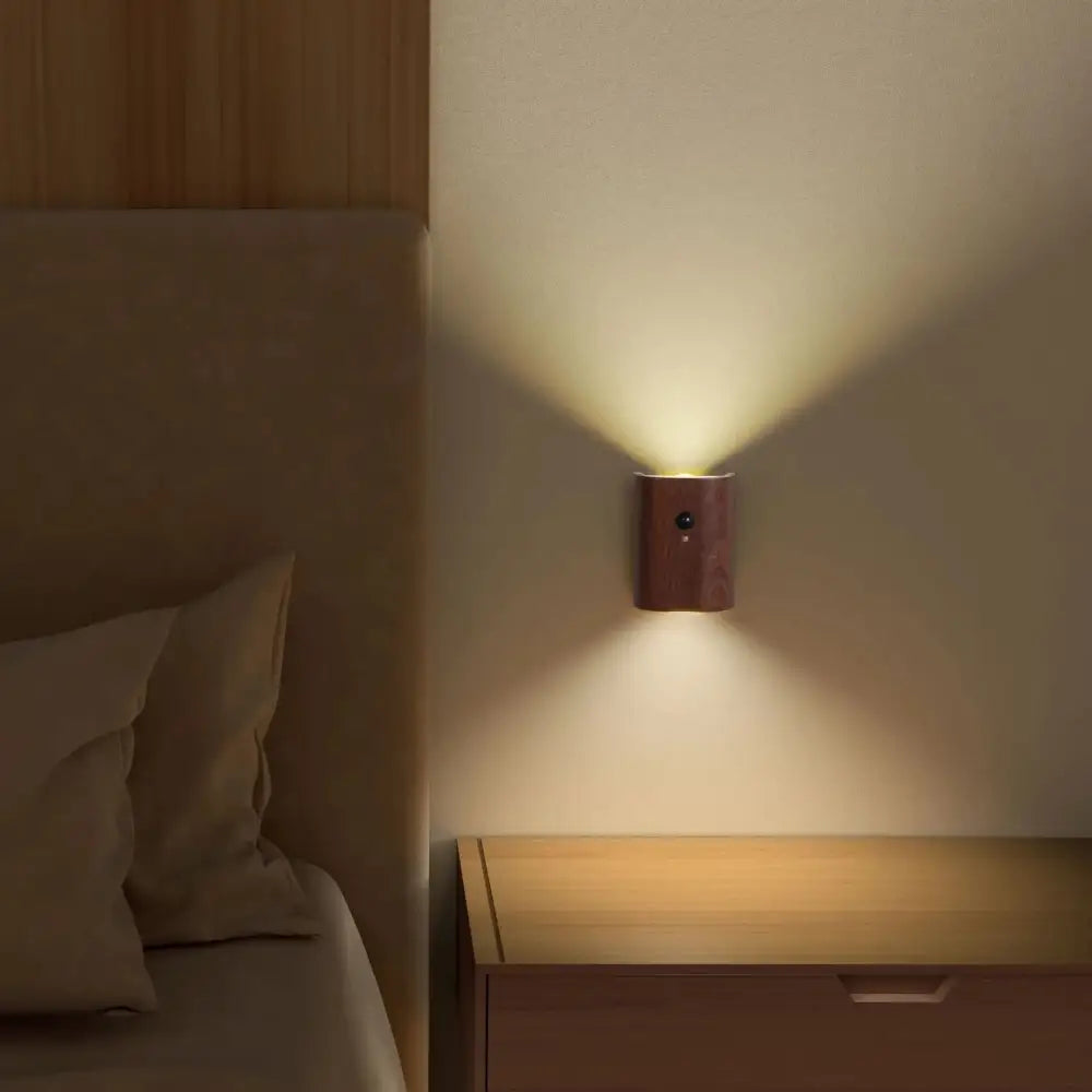 Warm-toned wooden decorbites™ odin battery operated wall sconce with sleek rectangular design and motion sensor function