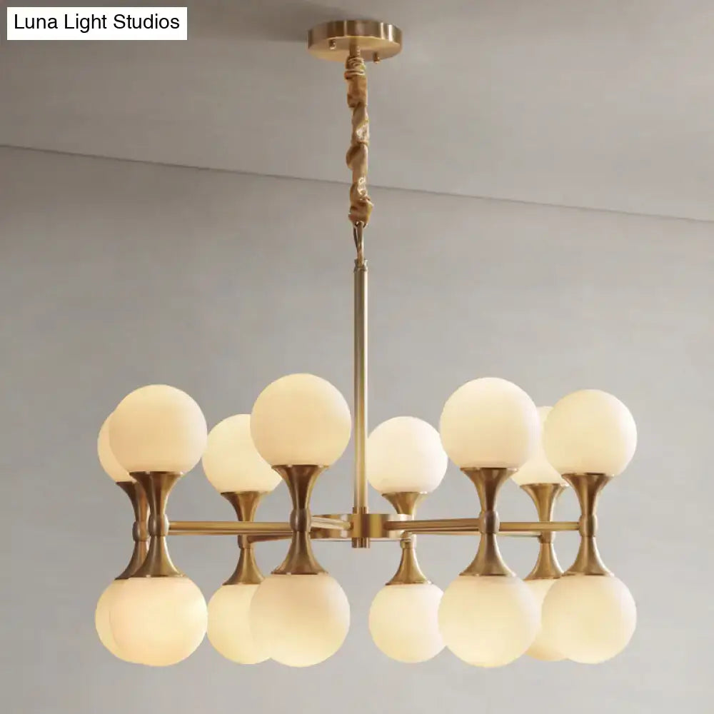 Decorbites™ opal glass chandelier light with 12 brass globe heads and frosted opal glass shades in modern design
