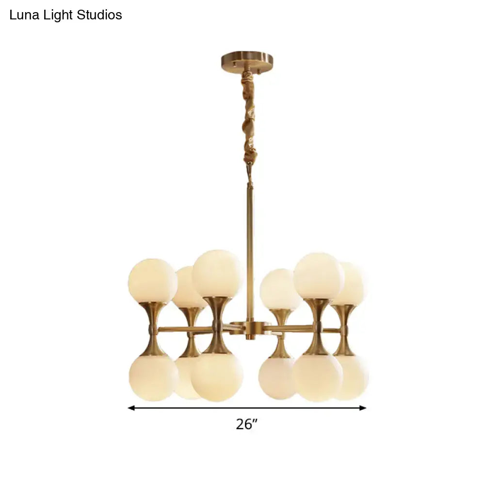 Gold-toned DecorBites™ opal glass chandelier light with eight frosted globe shades arranged in two tiers