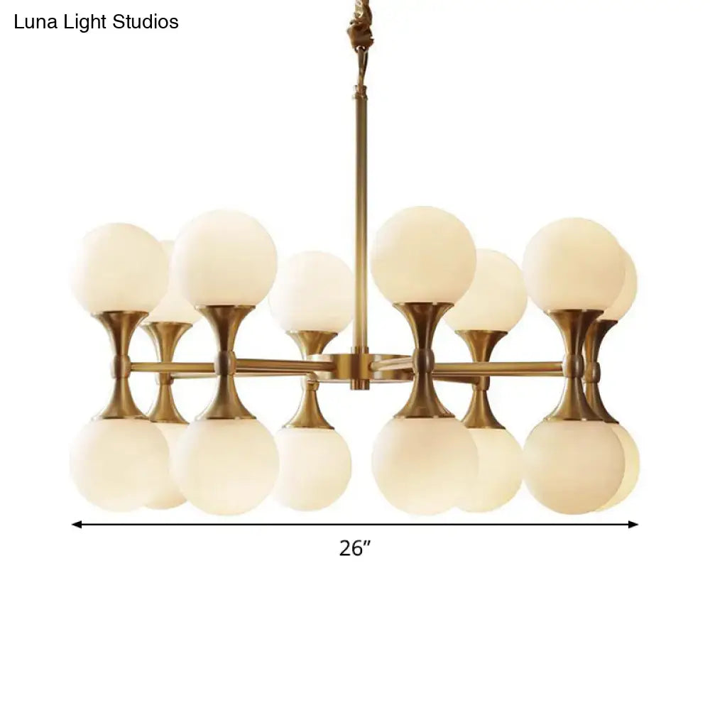 Brass-finished decorbites opal glass chandelier light with 12/16 frosted globe heads in a modern symmetrical design