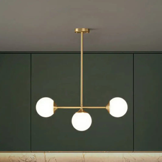 Gold-toned decorbites opaline glass ball pendant light with three frosted bulbs for minimalist dining room island
