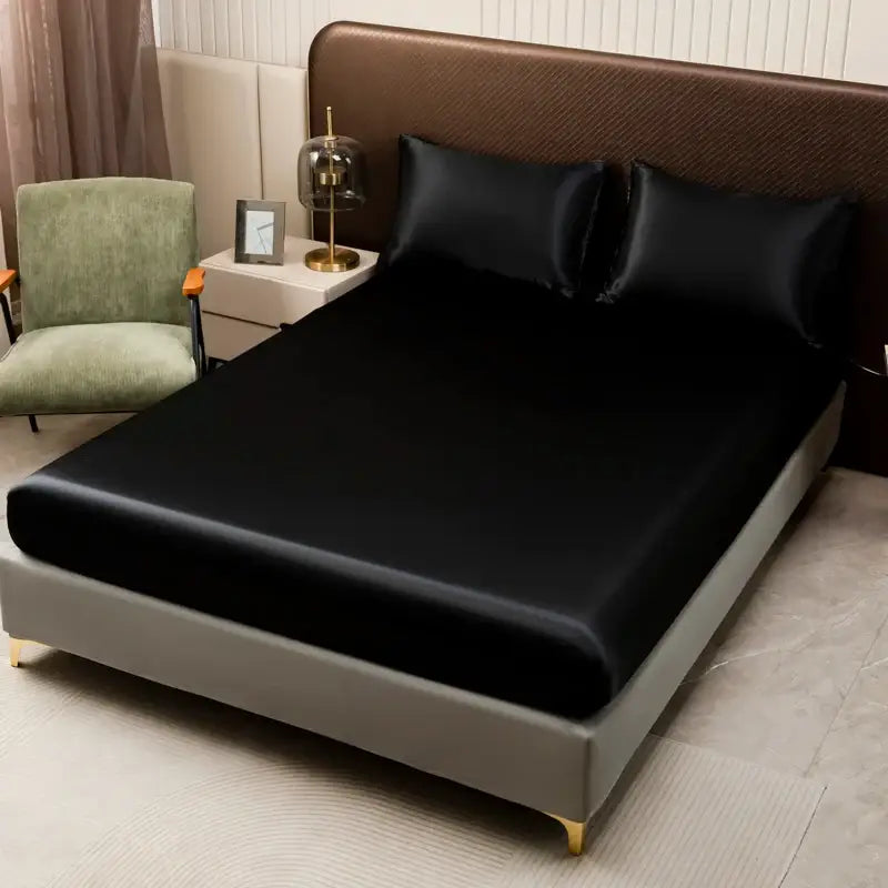 Black satin flat sheet from decorbites™ opulent solid color satin bedding set with a smooth glossy finish