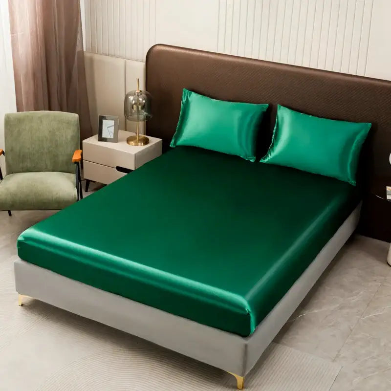 Emerald green satin bedding set from DecorBites™ featuring smooth glossy flat sheet and matching pillowcases